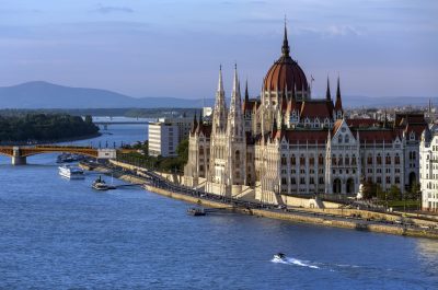 Late afternoon sunlight on the Hungarian Parliament Building in Budapest, Hungary. It is the seat of the National Assembly of Hungary. It lies in Lajos Kossuth Square, on the bank of the River Danube. It is currently the largest building in Hungary and is still the tallest building in Budapest.